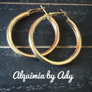 Gold-Toned Hoop Earrings with Hinged Closure and Polished Finish